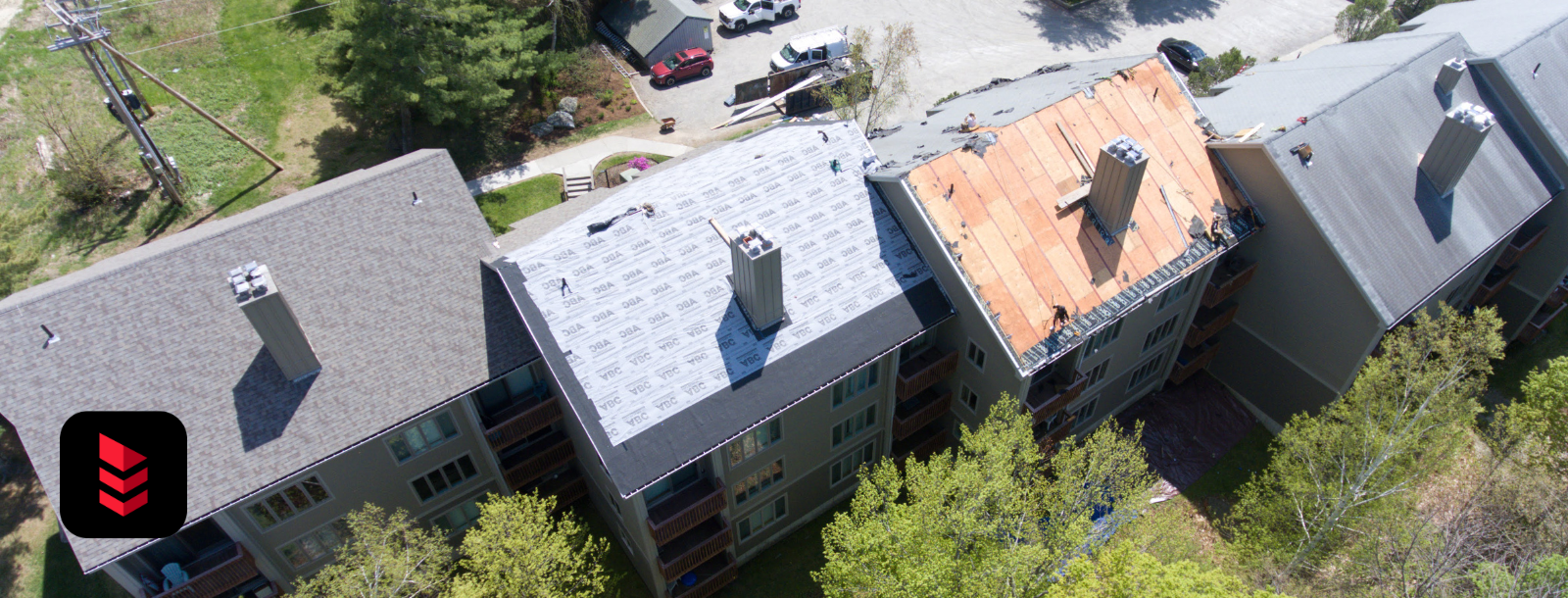 Commercial condo complex in Vermont undergoing shingle roof replacement by RoofPros.Plus